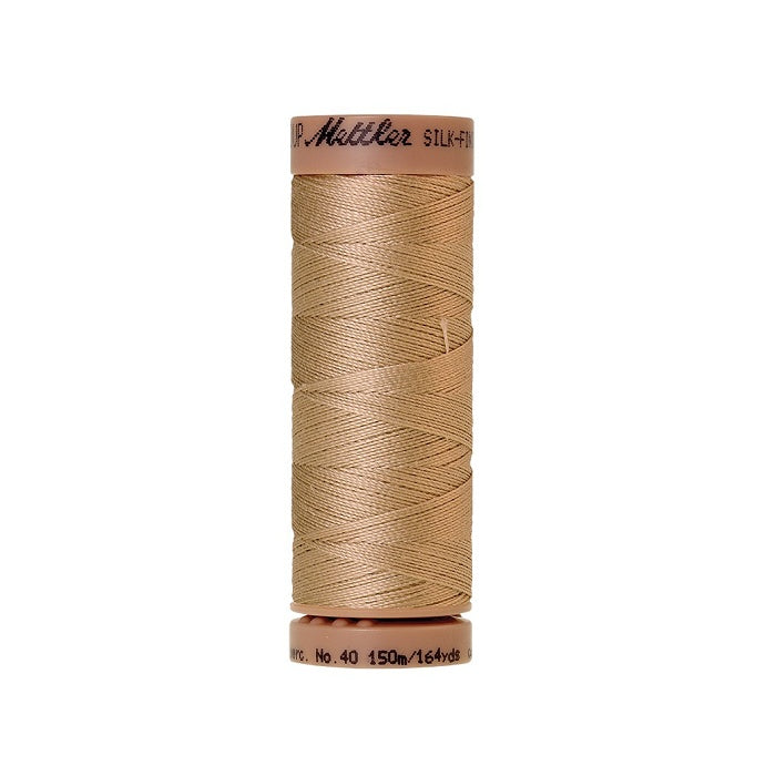 Beige thread with Mettler Cotton 40 branding.