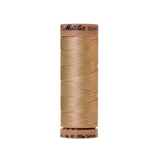 Beige thread with Mettler Cotton 40 branding.