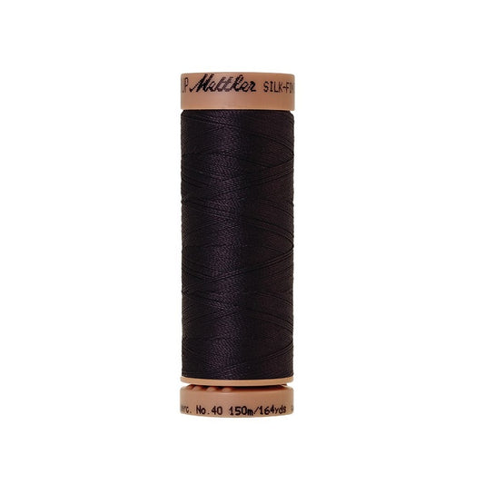 Very dark blue thread with Mettler Cotton 40 branding.