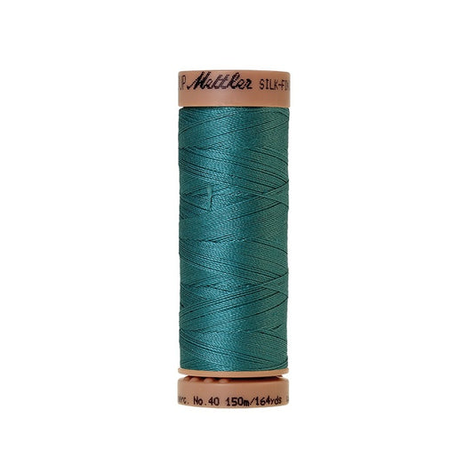 Blue green thread with Mettler Cotton 40 branding.