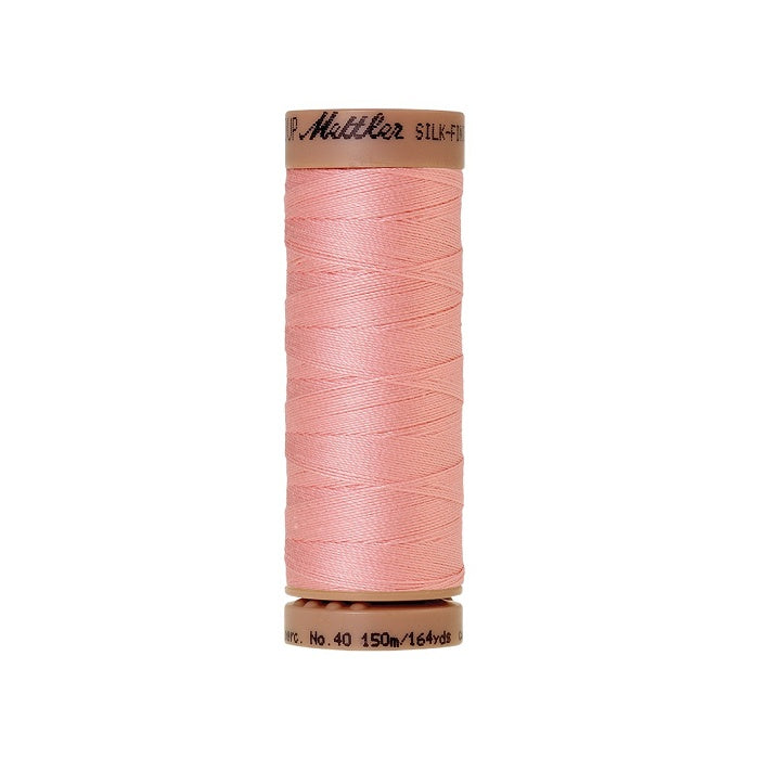 Pink thread with Mettler Cotton 40 branding.