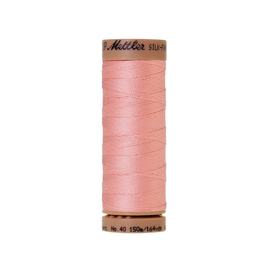 Pink thread with Mettler Cotton 40 branding.