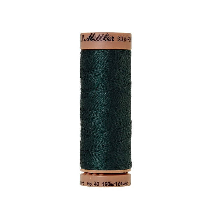 Very dark green thread with Mettler Cotton 40 branding.