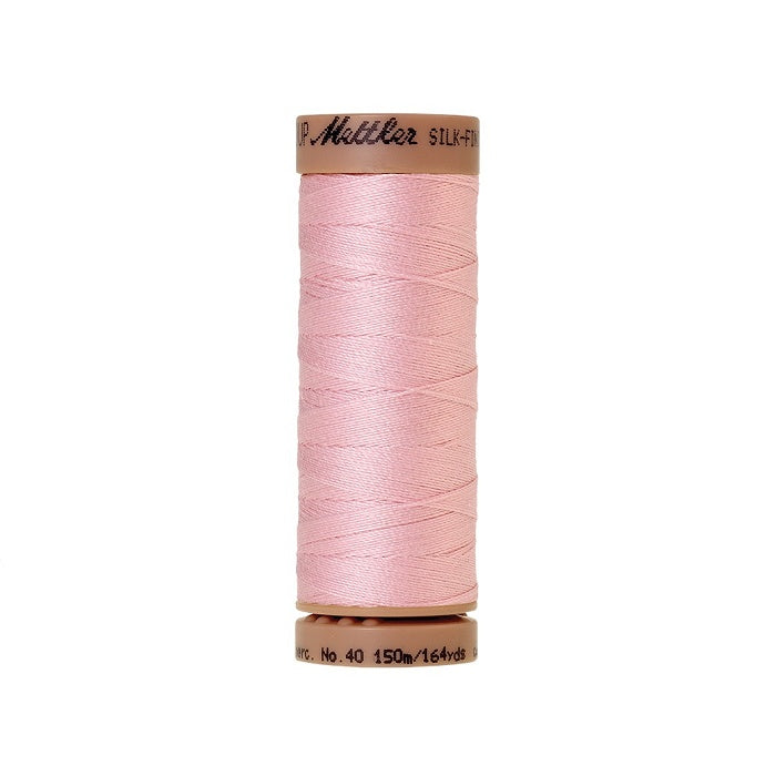 Pink thread with Mettler Cotton 40 branding.