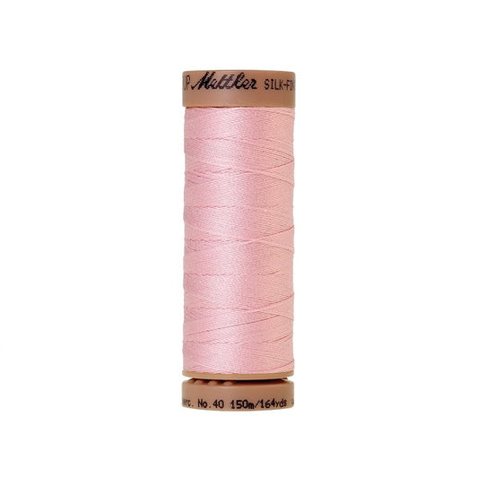 Pink thread with Mettler Cotton 40 branding.