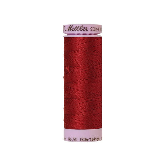 Dark red thread with Mettler Cotton 50 branding.