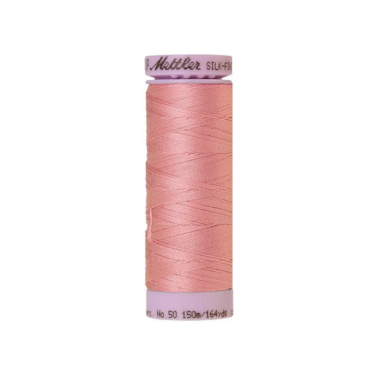 Pink thread with Mettler Cotton 50 branding.