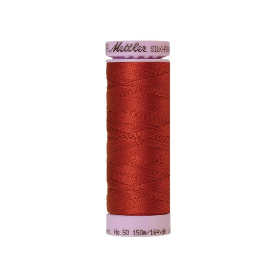 Red thread with Mettler Cotton 50 branding.