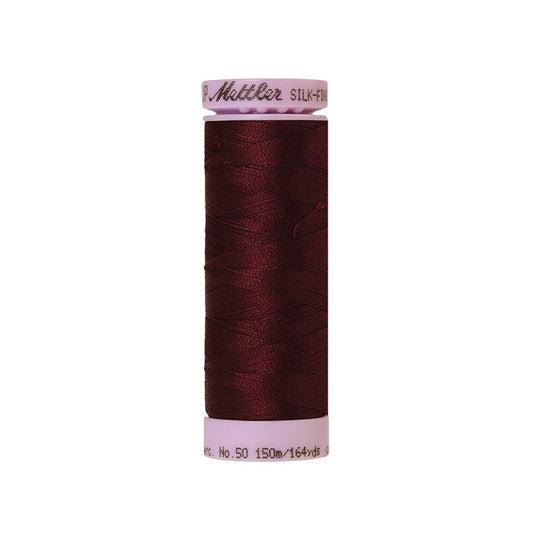 Very dark red thread with Mettler Cotton 50 branding.