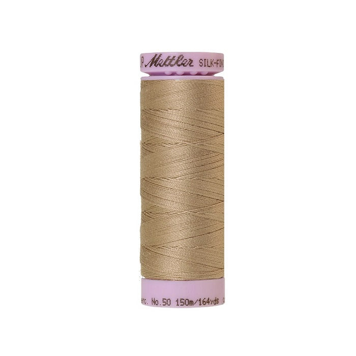 Light brown thread with Mettler Cotton 50 branding.