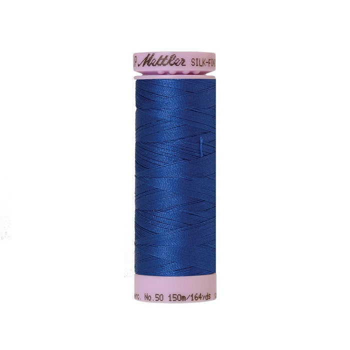 Royal blue thread with Mettler Cotton 50 branding.