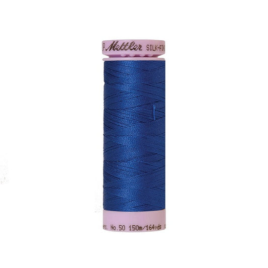 Royal blue thread with Mettler Cotton 50 branding.