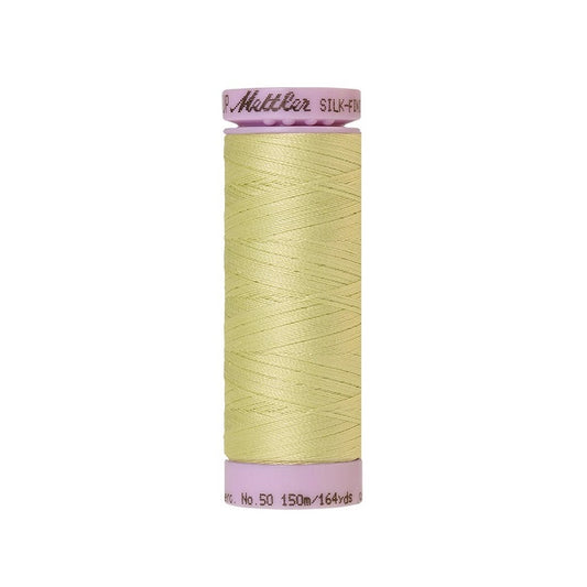 Very pale green thread with Mettler Cotton 50 branding.