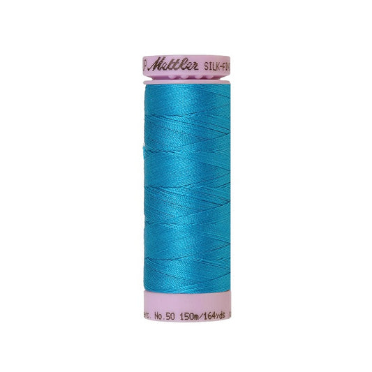 Blue thread with Mettler Cotton 50 branding.