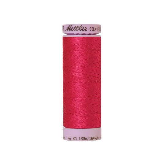 Pinkish red thread with Mettler Cotton 50 branding.