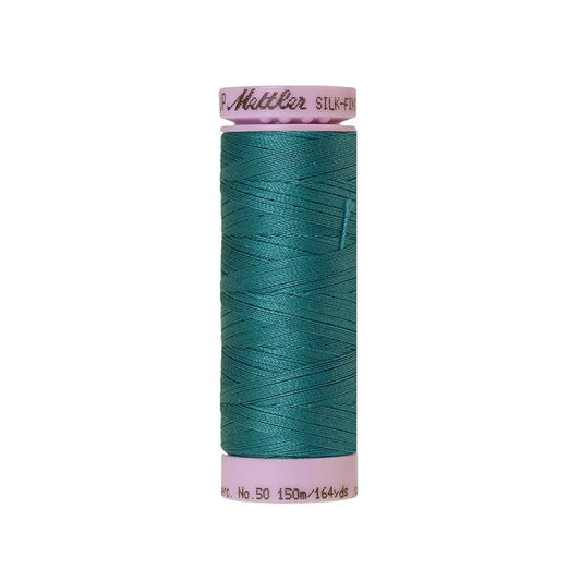 Teal blue thread with Mettler Cotton 50 branding.
