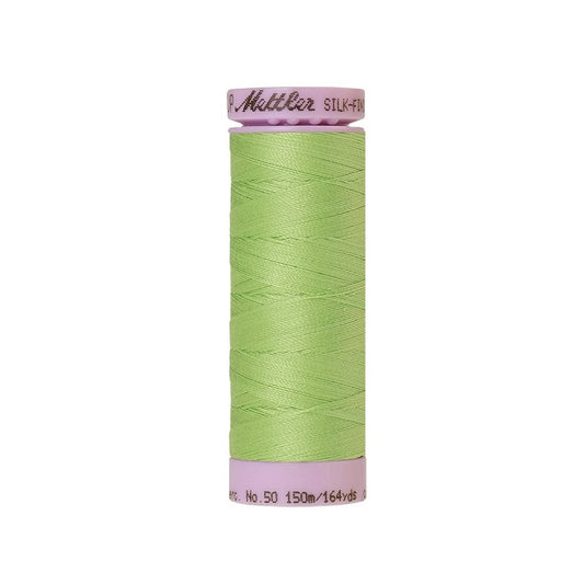 Lime green thread with Mettler Cotton 50 branding.