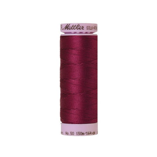 Dark red thread with Mettler Cotton 50 branding.