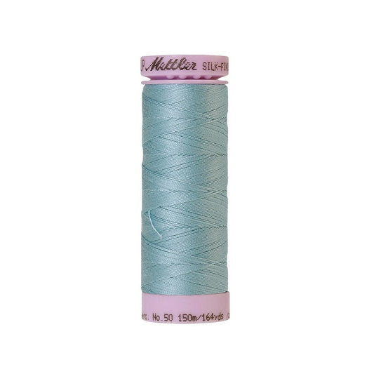 Light blue thread with Mettler Cotton 50 branding.