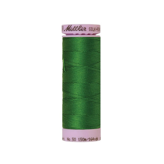 Green thread with Mettler Cotton 50 branding.