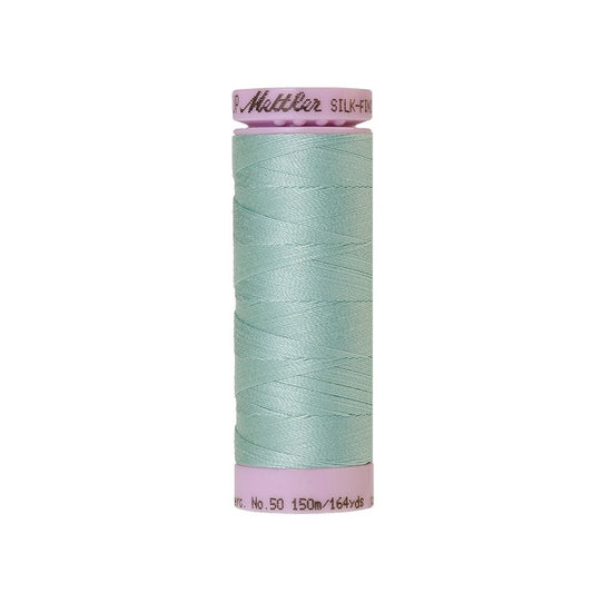 Light blue thread with Mettler Cotton 50 branding.