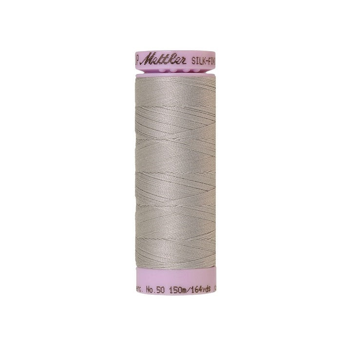 Light grey thread with Mettler Cotton 50 branding.