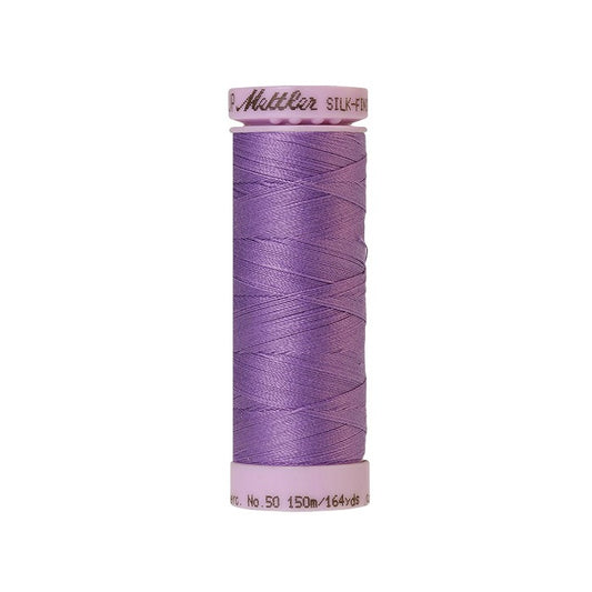 Purple thread with Mettler Cotton 50 branding.