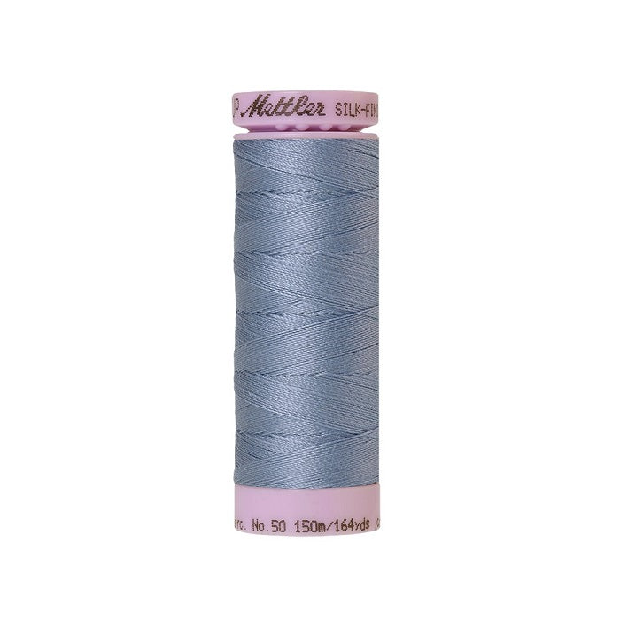 Light blue thread with Mettler Cotton 50 branding.