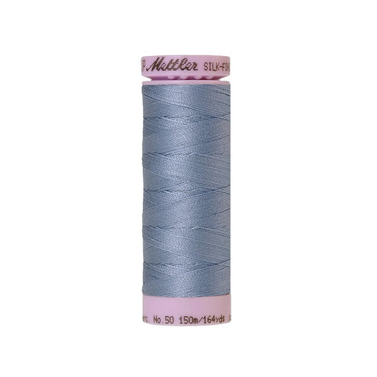 Light blue thread with Mettler Cotton 50 branding.