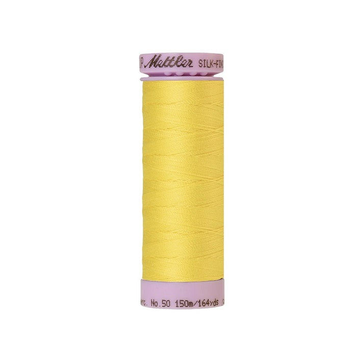 Yellow thread with Mettler Cotton 50 branding.