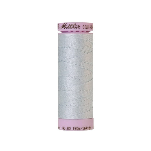Very light blue thread with Mettler Cotton 50 branding.