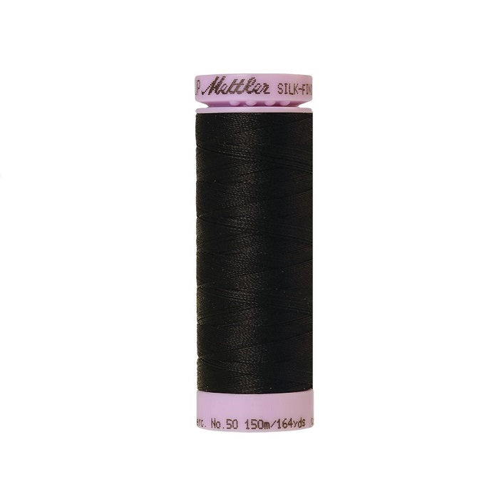 Black thread with Mettler Cotton 50 branding.