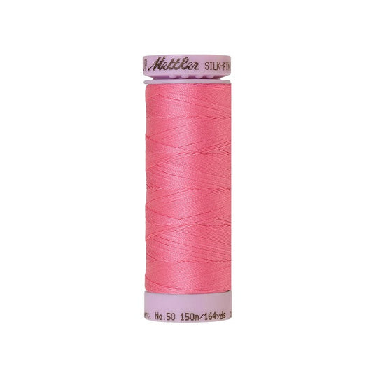 Pink thread with Mettler Cotton 50 branding.