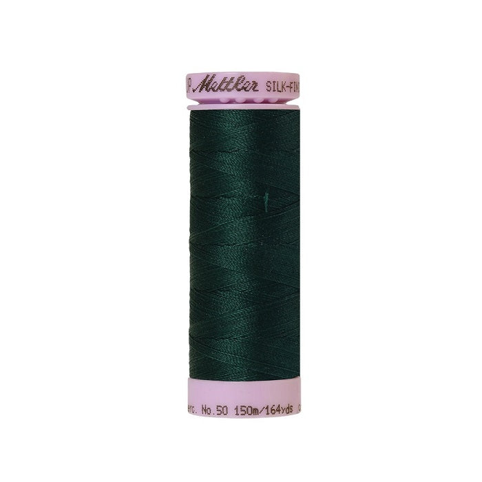 Very dark green thread with Mettler Cotton 50 branding.