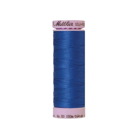 Blue thread with Mettler Cotton 50 branding.