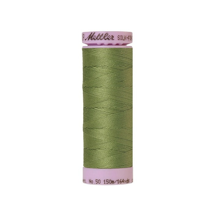 Light green thread with Mettler Cotton 50 branding.