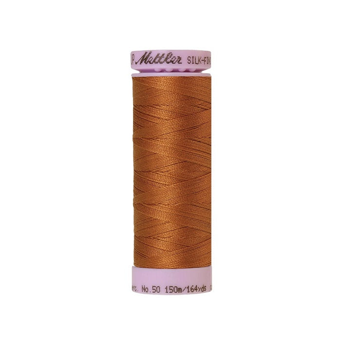 Bronze thread with Mettler Cotton 50 branding.