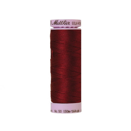 Dark red thread with Mettler Cotton 50 branding.