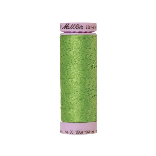 Light green thread with Mettler Cotton 50 branding.