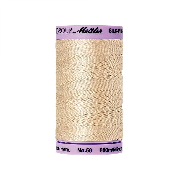 Beige thread with Mettler Cotton 50 branding.