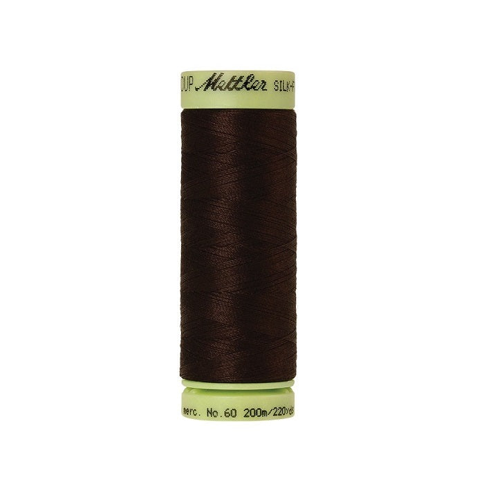 Very dark brown thread with Mettler Cotton 60 branding.