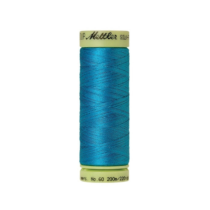 Blue thread with Mettler Cotton 60 branding.
