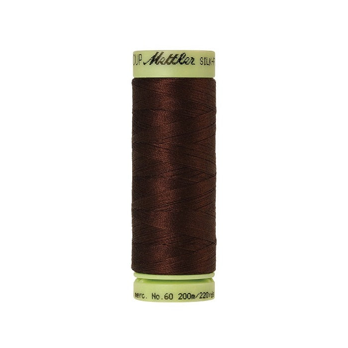 Very dark brown thread with Mettler Cotton 60 branding.