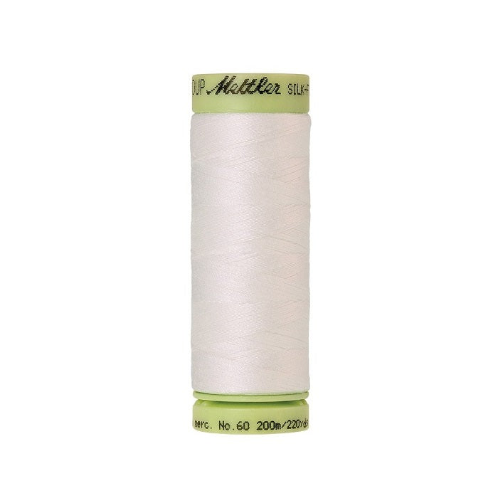 Off white thread with Mettler Cotton 60 branding.