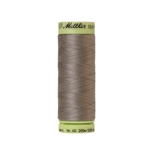 Light brown thread with Mettler Cotton 60 branding.