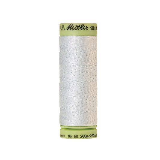 Very pale green thread with Mettler Cotton 60 branding.