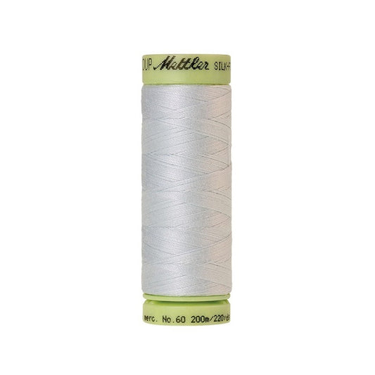 Very pale blue thread with Mettler Cotton 60 branding.