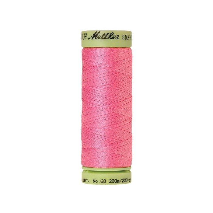 Pink thread with Mettler Cotton 60 branding.