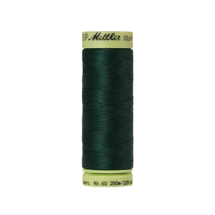 Dark green thread with Mettler Cotton 60 branding.