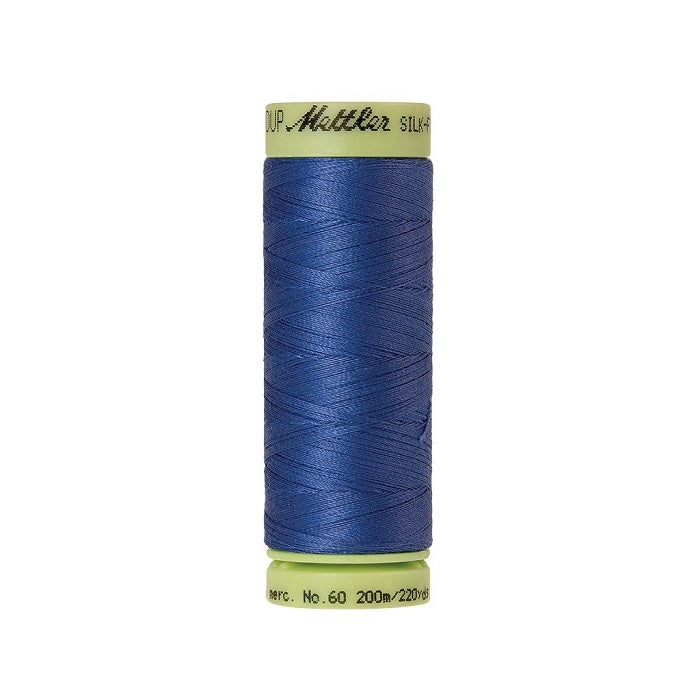 Blue thread with Mettler Cotton 60 branding.